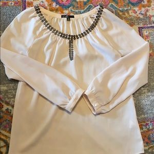 C. Puce silk top
